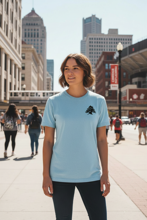 Person wearing vintage baby blue Cedar of Lebanon tee in downtown Detroit